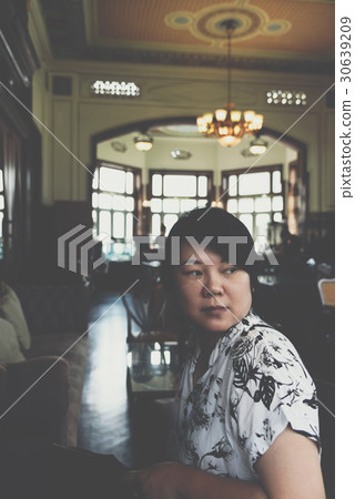 Asian women smile in coffee shop vintage style Asian women smile in coffee shop vintage style 30639209