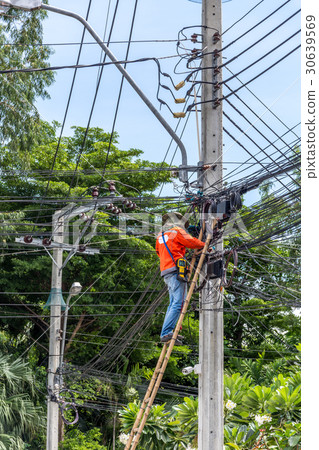 Working to install electric line 30639569