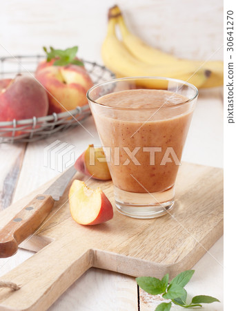 peach smoothie in glass peach smoothie in glass 30641270