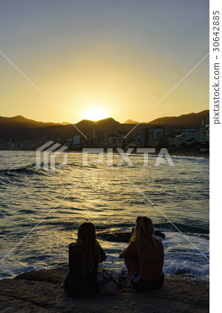 Girls over th stone at dusk 30642885