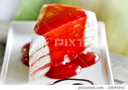 crepe cake with strawberry sauce topping 30644842