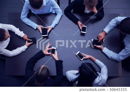 Business people with smartphones 30645335