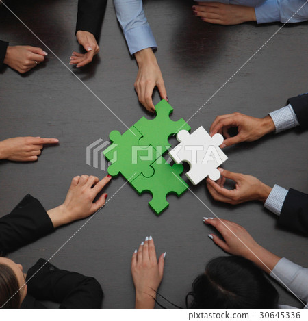 Business people assembling puzzle 30645336