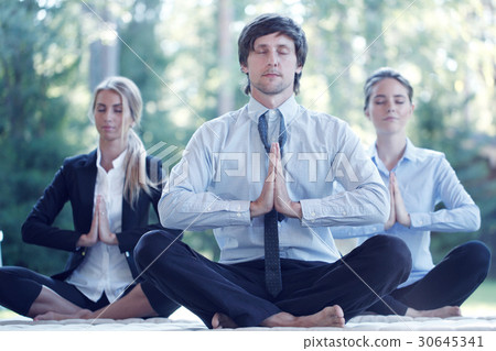 Business people practicing yoga Business people practicing yoga 30645341