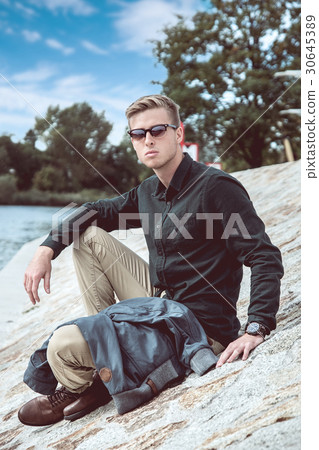 Stylish young handsome man with fancy sunglasses 30645389