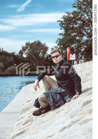 Stylish young handsome man with fancy sunglasses Stylish young handsome man with fancy sunglasses 30645390