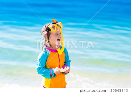 Child snorkeling on tropical beach 30645543