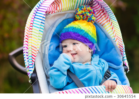 Baby boy in stroller in autumn park 30645554
