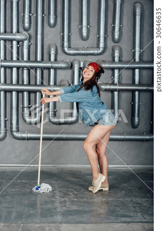 Beautiful sexy girl with a mop in hands 30646635