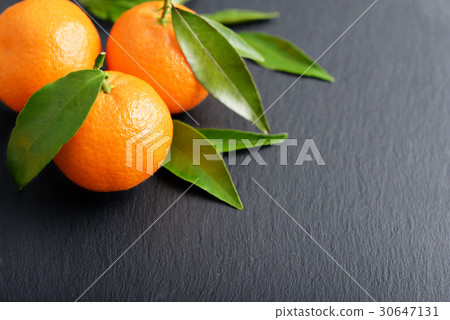 Tangerines with leaves 30647131