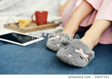 Girl in cute slippers Girl in cute slippers 30647341