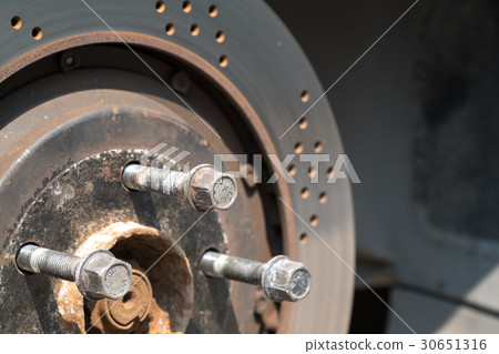 Front disc brake on car in process of new tire 30651316