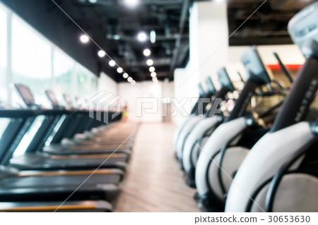 Abstract blur gym and fitness room interior Abstract blur gym and fitness room interior 30653630