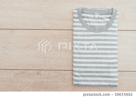 T shirt on wooden background T shirt on wooden background 30655602