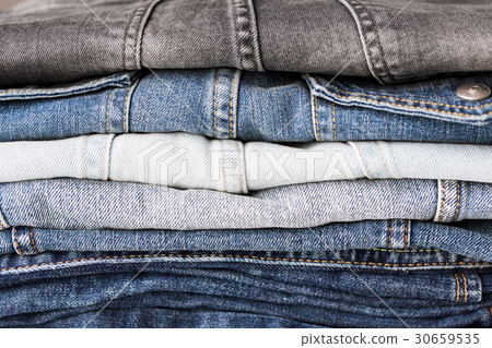 close up of denim clothes or jeans pile 30659535