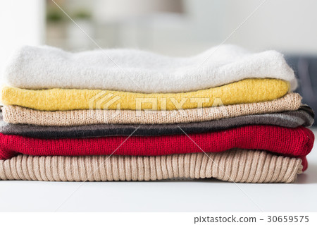 close up of stacked knitted clothes close up of stacked knitted clothes 30659575