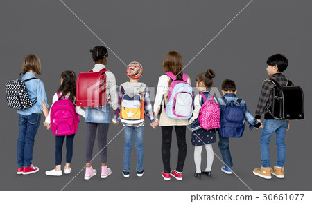 Rear view group of diverse kids standing in a row holdings hands 30661077