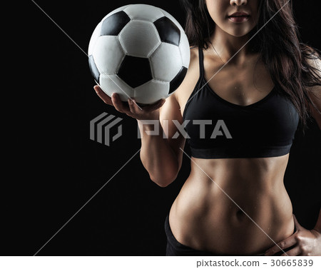 Beautiful body of fitness model holding soccer ball Beautiful body of fitness model holding soccer ball 30665839