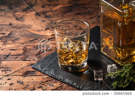 Whiskey with ice in glasses 30665868