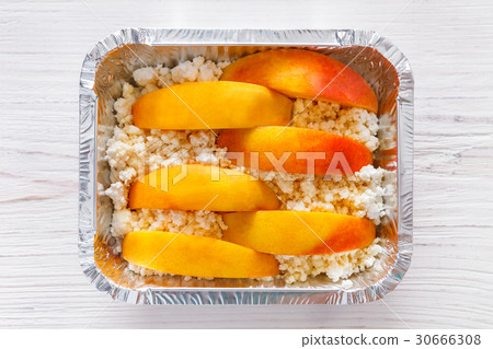 Healthy food in foil box, diet concept. Apple Healthy food in foil box, diet concept. Apple 30666308