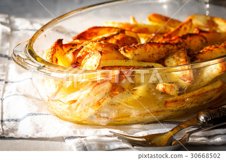 Homemade baked potatoes with spices Homemade baked potatoes with spices 30668502