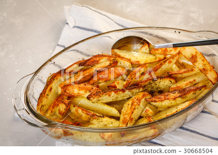 Homemade baked potatoes with spices  30668504