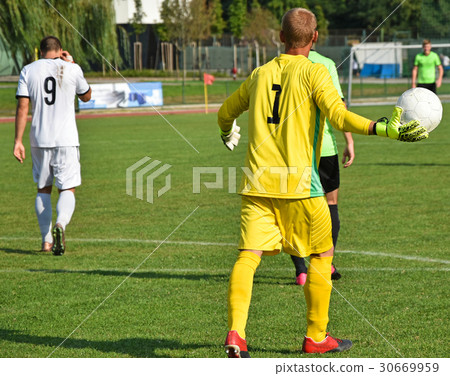 Soccer goalkeeper throws out the ball 30669959