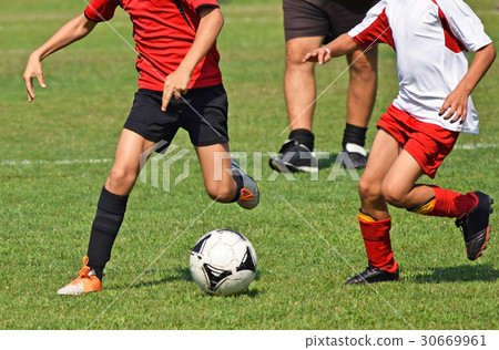 Children are playing soccer 30669961