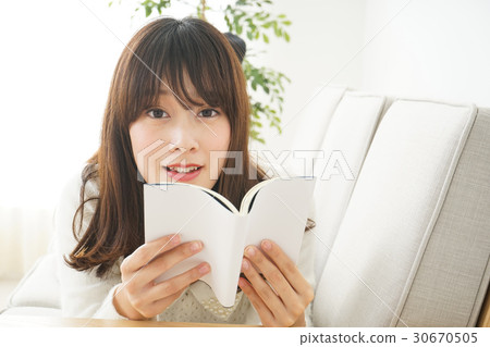 A young Japanese woman reading A young Japanese woman reading 30670505