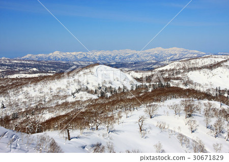 Mountain ranges of Shakotan Peninsula distant from Onuma mountain in early spring Mountain ranges of Shakotan Peninsula distant from Onuma mountain in early spring 30671829