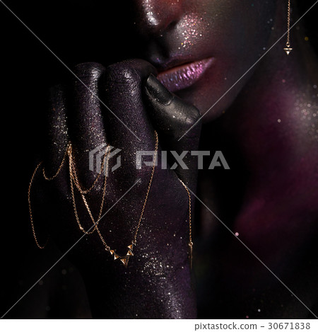 Beautiful girl with art space makeup on her face 30671838