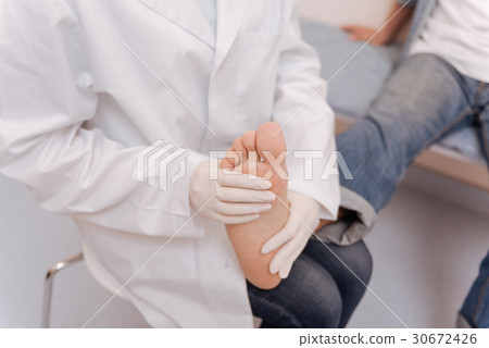 Advanced qualified rheumatologist giving medical Advanced qualified rheumatologist giving medical 30672426