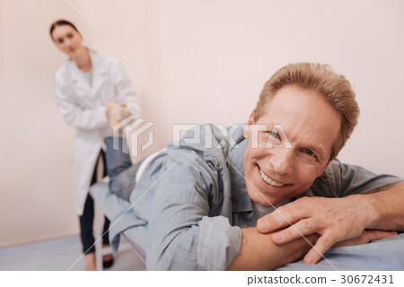 Mature man enjoying medical treatment Mature man enjoying medical treatment 30672431