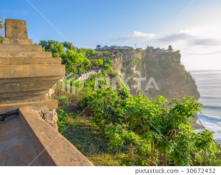 Uluwatu Temple cliff wall in sunset fog. 30672432