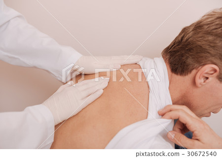 Good delicate rheumatologist massaging patients Good delicate rheumatologist massaging patients 30672540