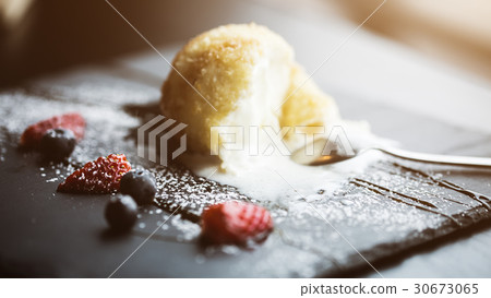 Grilled ice-cream in coconut with sauce on black 30673065