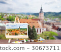 Easel with a watercolor painting 30673711