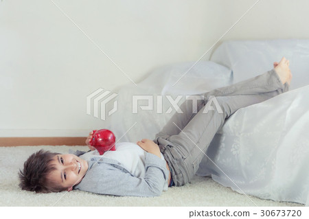 School boy with piggy bank 30673720