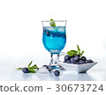 Alcoholic cocktail with blueberries and mint.  30673724