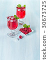 Alcohol cocktail with raspberries and mint 30673725