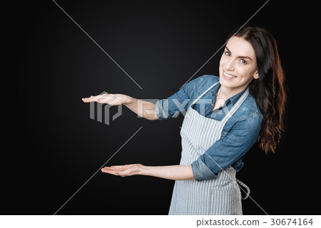 Attractive brunette smiling on camera Attractive brunette smiling on camera 30674164