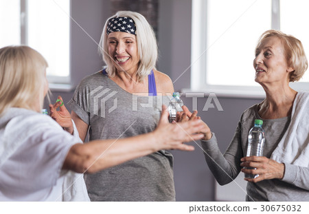 Delighted positive women having a conversation Delighted positive women having a conversation 30675032