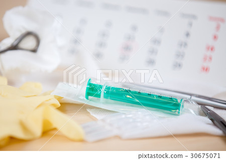 A table with medical instruments A table with medical instruments 30675071