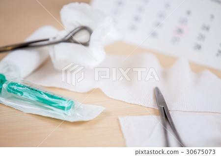 A table with medical instruments A table with medical instruments 30675073