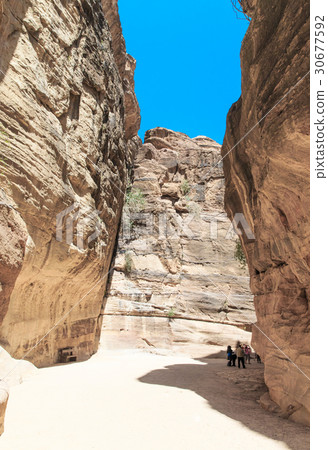 red rock formations in Petra Jordan. red rock formations in Petra Jordan. 30677592