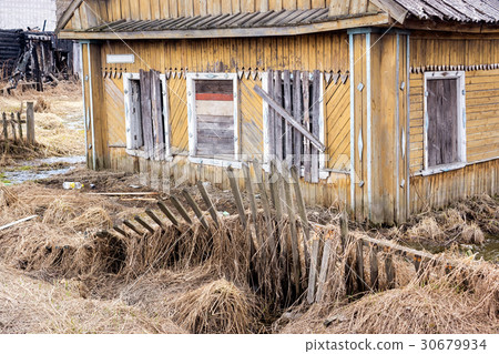 Abandoned collapsing wooden house 30679934