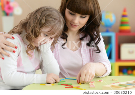 Mother and daughter doing lessons Mother and daughter doing lessons 30680210