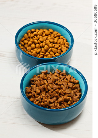 Two bowls with pet's meal on the floor Two bowls with pet's meal on the floor 30680699