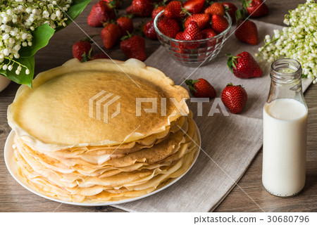 Delicious pancakes on wooden table with 30680796