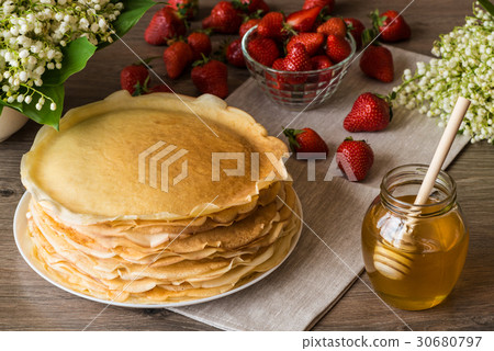 Delicious pancakes on wooden table with 30680797